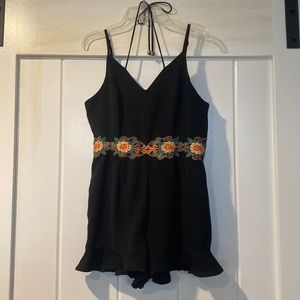 Francesca’s black and floral ruffly romper